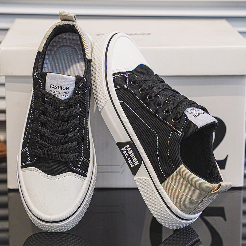 Men's Breathable Canvas Skate Shoes by Erabyte in black and white with a stylish design and textured sole.