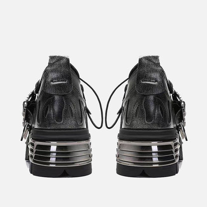 Erabyte dark punk little leather shoes featuring a sleek black design with metallic accents and unique back detailing.