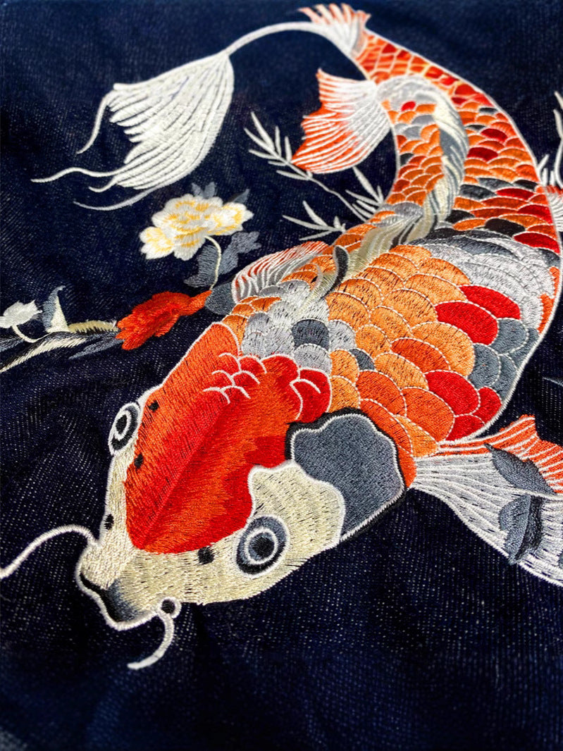 Embroidery Denim Jacket Retro Loose Fit by Erabyte featuring intricate koi fish design in vibrant colors on dark denim.