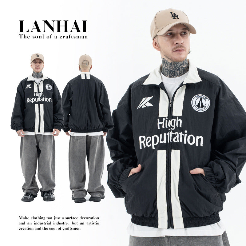 Erabyte Men's Jacket in black with white stripes and logo, paired with gray pants and a beige cap. Casual streetwear style.