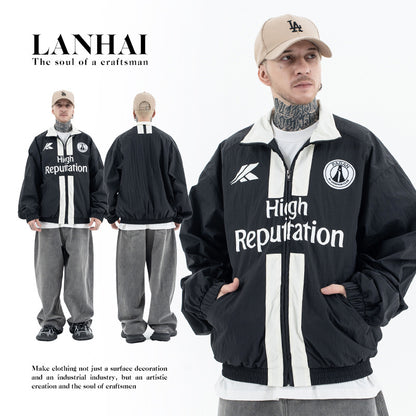 Erabyte Men's Jacket in black with white stripes and logo, paired with gray pants and a beige cap. Casual streetwear style.