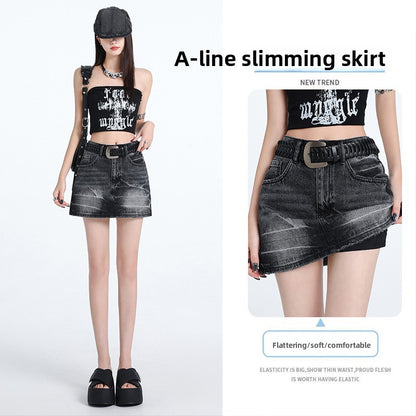 A-line slimming denim skirt in black with a distressed finish, featuring a high waist and stylish belt. Ideal for punk fashio