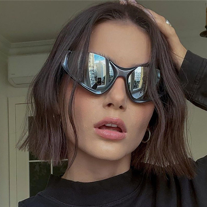 Erabyte Punk Style Half Frame Sunglasses with reflective lenses, worn by a model with shoulder-length hair, ideal for outdoor