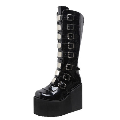 Erabyte punk boots featuring a glossy black finish, multiple silver buckles, and a chunky platform sole.