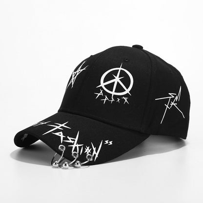 Erabyte Hat Man Baseball Cap in black featuring peace symbol and graffiti-style designs with metal rings on the brim.